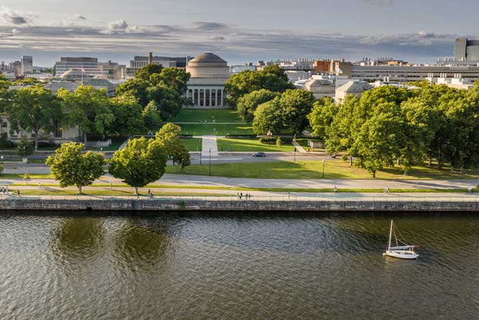 aerial shot of river and campus